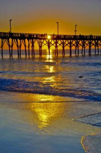 sun over pier